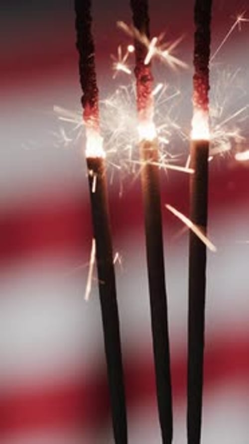 Sparkling Sparklers Against a Red and White Background