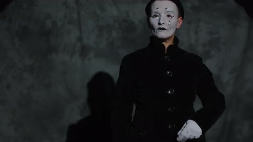 Female Mime Performer Demonstrating Magic Tricks