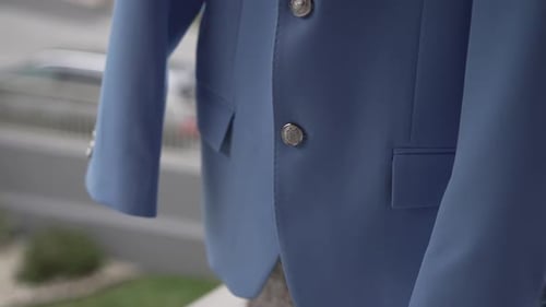 Close up of elegant blue wedding suit with detailed buttons