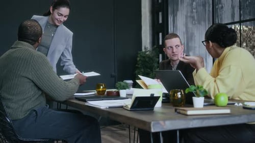 Young Multiethnic Business Team Coworking Together at One Table in Office