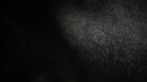 Dynamic Sparkling White Particles on Dark Background