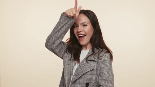 Happy Brunette Woman Dancing and Smiling