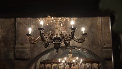 Close up of gold chandelier inside of a beautiful old Greek church