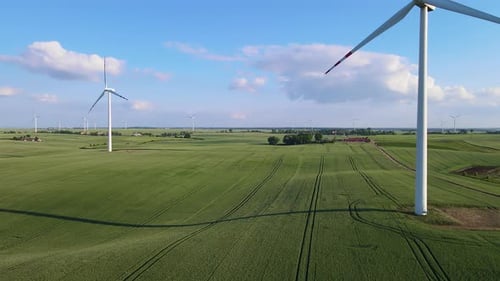 Efficient Electricity Production By Wind Generator Countryside Wind Turbine in Motion Over Farm