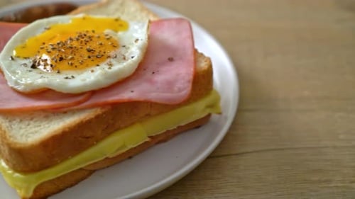 Breakfast Sandwich with Ham, Cheese, and Fried Egg