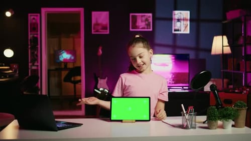 Cheerful Kid Using Chroma Key Tablet to Present Promotion From Media Partner to Followers
