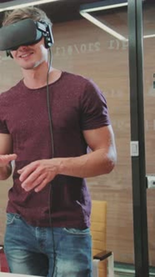Man Using VR Headset in Modern Office