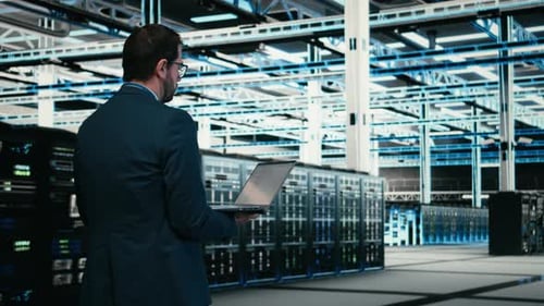 Writing Code Laptop Program and Software Developer in Data Center