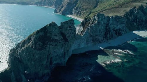 Aerial Panoramic View of Cliffs and Huge Rocks at Seaside and Waves Crashing to the Coast Beautiful