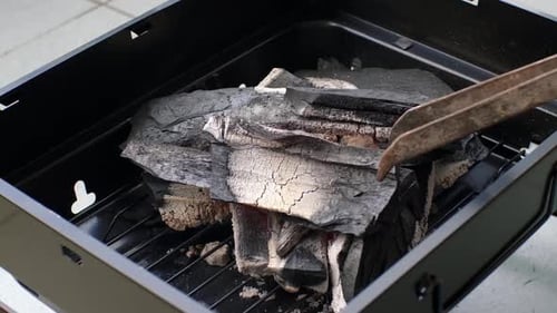 Igniting Charcoal for Outdoor Barbecue Grill Cooking