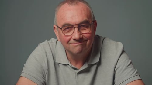 Close Up of Adult Smiling in Gray Shirt