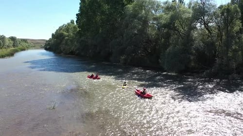 Aerial View Of Group Of People Canoeing On The River 2