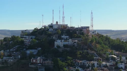 Telecommunication Towers on Hilltop Overlooking Residential Area in Durango