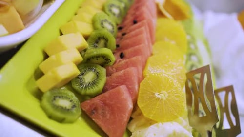 healthy fruits breakfast food buffet ,plates and table at a hotel