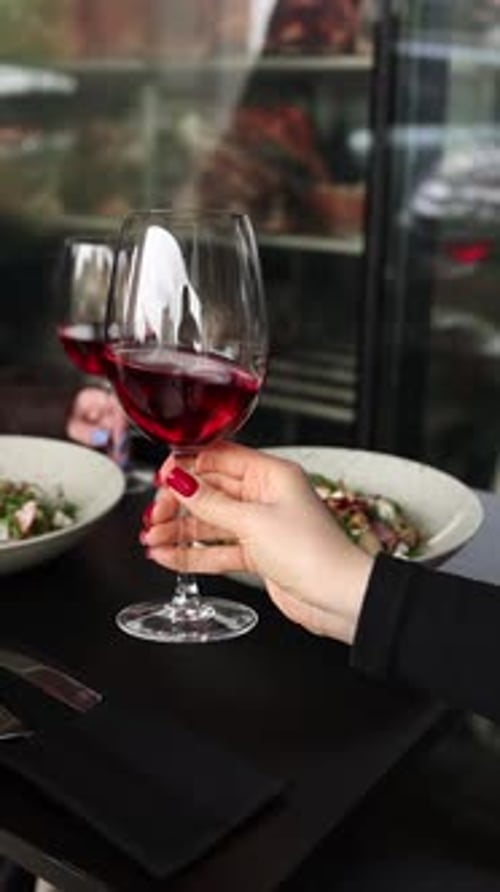 a glass of red wine in a restaurant