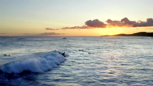 Cinematic - Surfers in Hawaii at Sunset, Aerial Drone