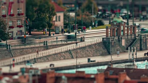 A lovely autumn day in Prague, Czechia. Passerbys enjoying the walk on the river bank - Naplavka. So