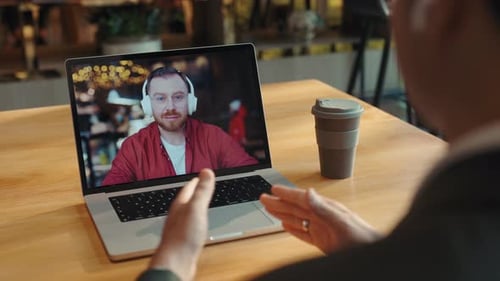 Video Conference on Laptop in Workspace