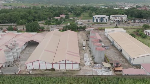 Aerial View of a large factory, dolly left
