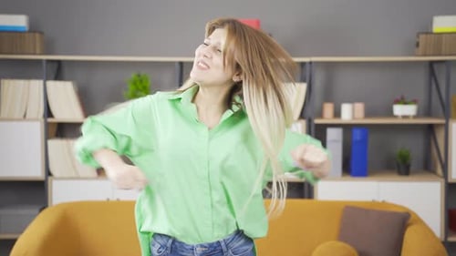 Woman Dancing Energetically Indoors