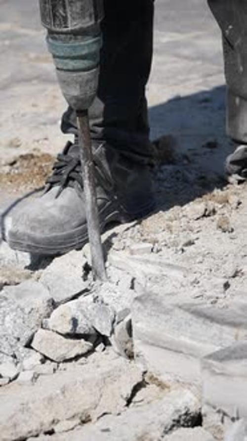 Jackhammer Breaking Concrete on a City Street