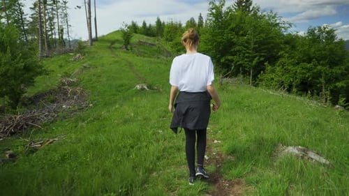 Teen Ager Girl Is Trekking In The Mountains Of Slovakia Carpathians. Tracking Shot
