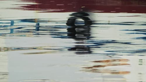 Boat Reflection On Sea Water In The Rain