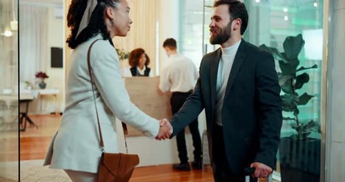 Businessman, woman and handshake in hotel for b2b meeting, introduction and welcome