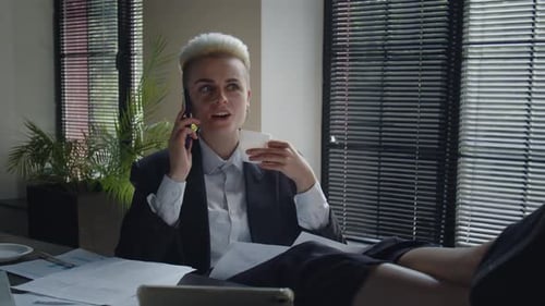 Young Business Woman Takes a Break During Work Day at Office Attractive Female Entrepreneur Drinking
