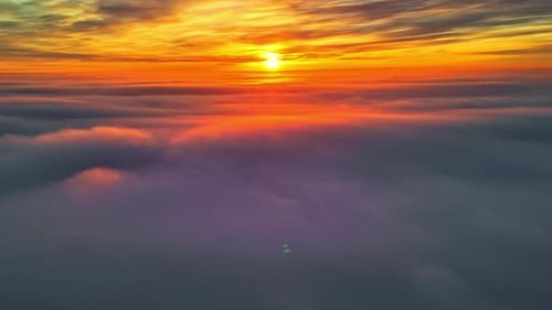Golden Sunset Over The Clouds. - aerial shot