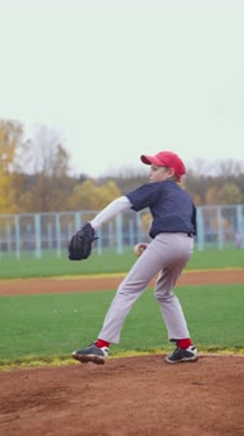 Baseball Game a Boy Pitcher Throws the Ball Towards the Batter School Sports Baseball Tournament