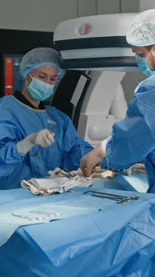 Surgeons Prepare Instruments in Hospital Operating Room