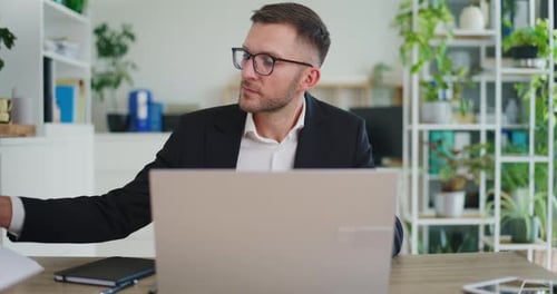 Concentrated Businessman Working in Office