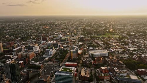 An aerial view of a city at sunset