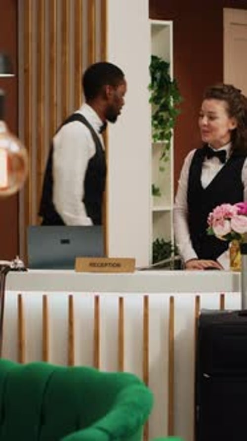 Vertical Video Senior People Receive Room Key Card