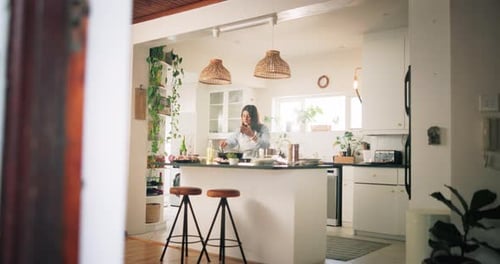 Woman Cooking in Bright White Kitchen