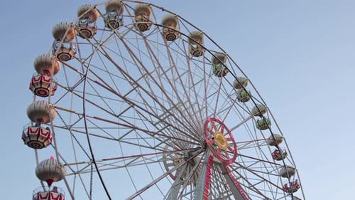 Ferris Wheel In Amusement Park On A Cloudless Day