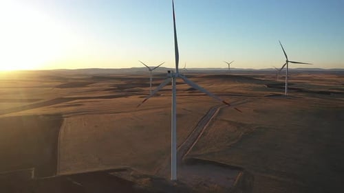 Aerial View Of Wind Power Plants At Sunset