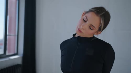 Woman Stretching Her Neck Indoors