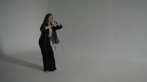 Woman Dancing Barefoot in Studio
