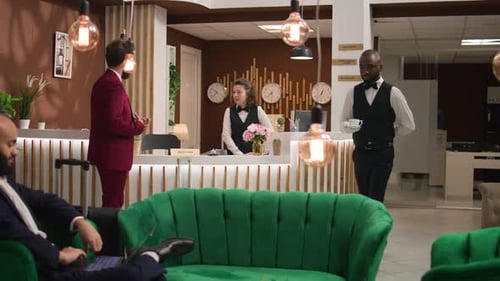 People in Modern Hotel Lobby, Brightly Lit