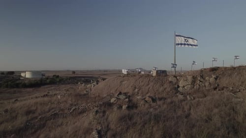 Aerial View of Israeli Flags on Arid Landscape