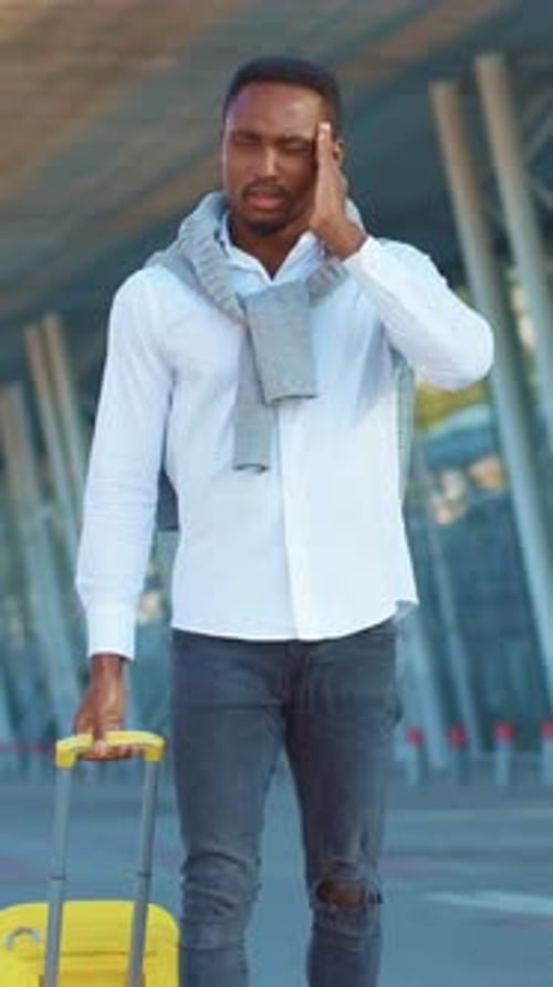 A Stylish Traveler with Luggage at the Airport Ready for a New Adventure Awaits you