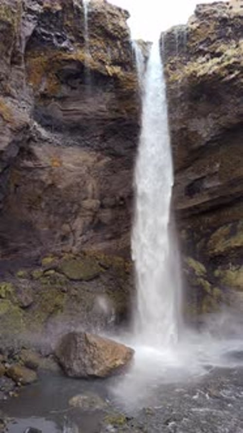 Scenic Waterfall Cascading Down Rocky Cliff Face