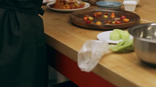 Chef Prepares Fresh Ingredients and Arranges a Salad