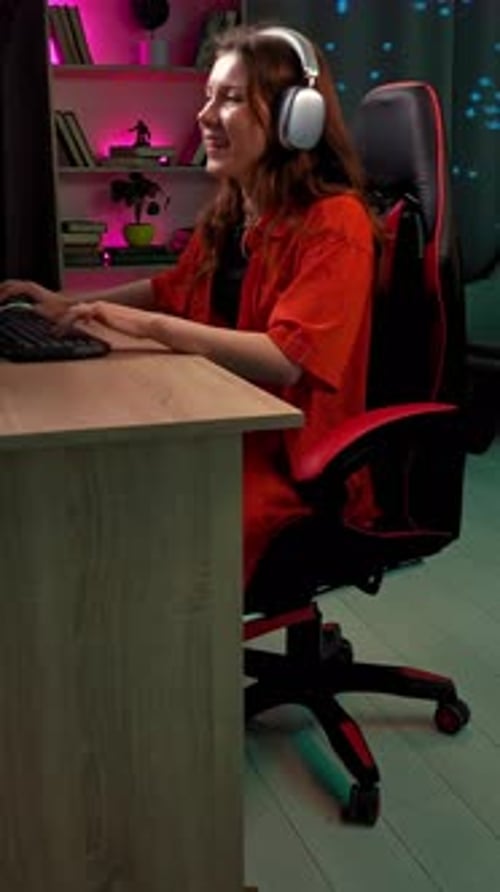Woman Playing Video Games at Computer Desk
