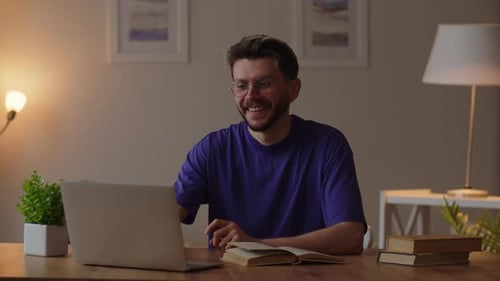 Man Talking on Laptop Video Call Indoors