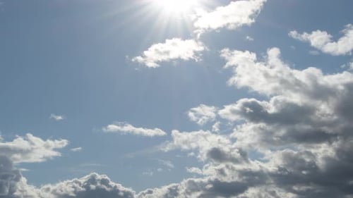 Clouds and Sun in Blue Sky