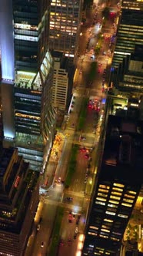 The variety of building in New York architecture. Drone slowly descending between the skyscrapers