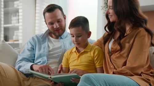 Happy Family Reading a Book Together